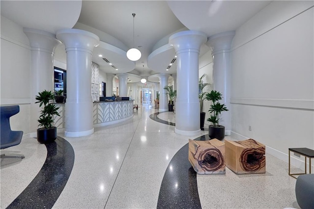 reception area featuring decorative columns