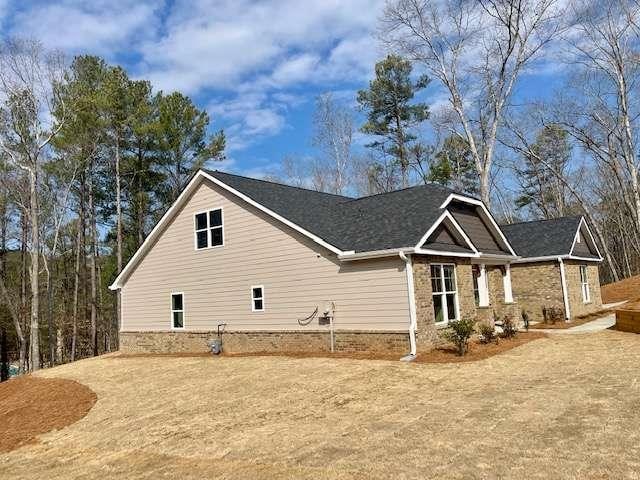 view of property exterior with a yard