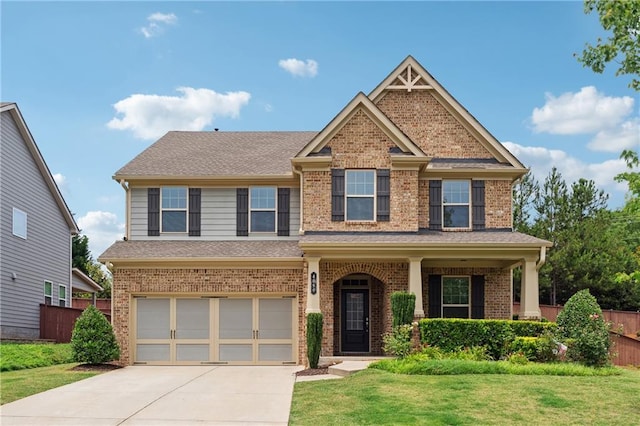 4090 Danbury Farms Dr, Cumming, GA 30040 - craftsman inspired home with brick siding, an attached garage, driveway, and a shingled roof