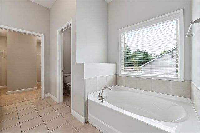 4090 Danbury Farms Dr, Cumming, GA 30040 - full bath with a bath, toilet, tile patterned floors, a spacious closet, and baseboards