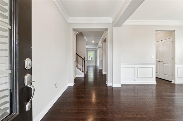 4090 Danbury Farms Dr, Cumming, GA 30040 - foyer entrance featuring wood finished floors, stairs, ornamental molding, and baseboards