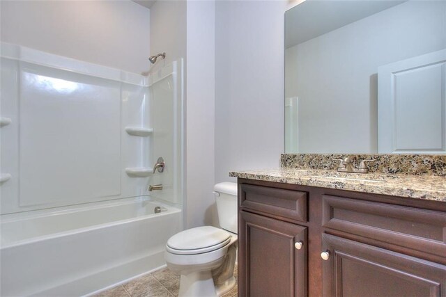 full bathroom with vanity, toilet, tile patterned flooring, and shower / washtub combination