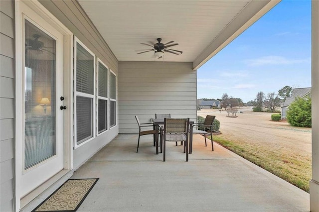 view of patio featuring ceiling fan