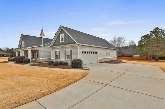 view of side of property featuring a garage and covered porch