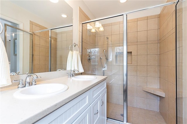 bathroom with vanity and an enclosed shower