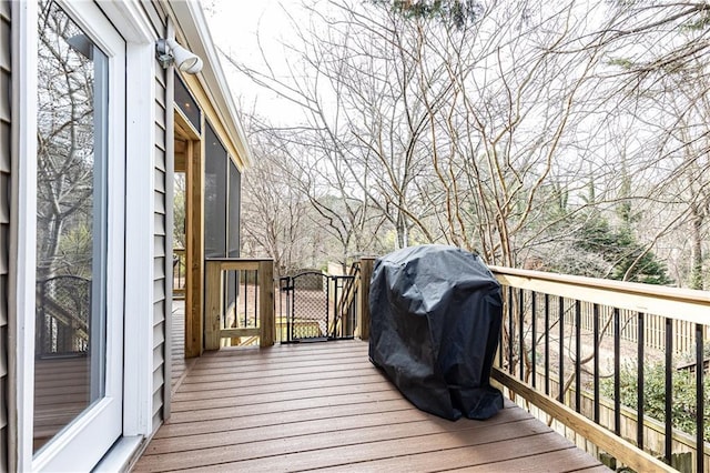 wooden terrace with area for grilling