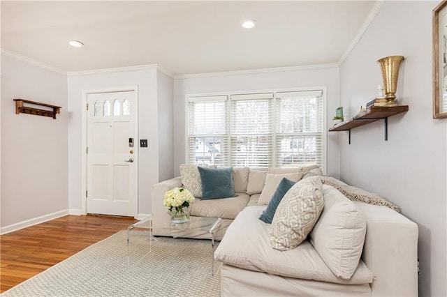 living room with hardwood / wood-style flooring and ornamental molding