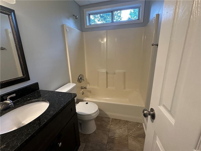 bathroom featuring toilet, bathing tub / shower combination, and vanity