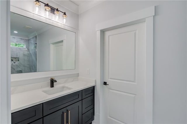 full bath with vanity and a marble finish shower