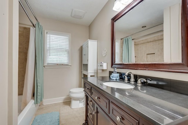 full bathroom featuring tile patterned flooring, vanity, shower / bath combo, and toilet