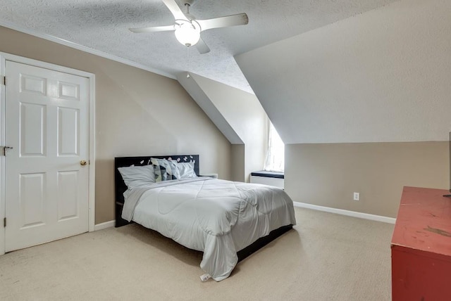 carpeted bedroom featuring a textured ceiling, ceiling fan, and vaulted ceiling