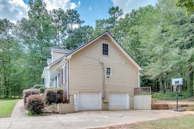 view of side of home with a garage