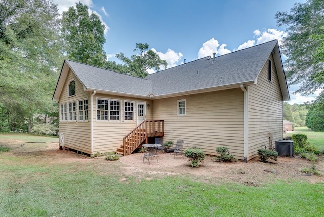 back of house with a yard, cooling unit, and a patio