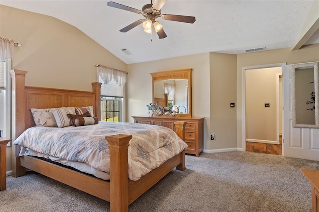 bedroom with lofted ceiling, light colored carpet, visible vents, and ceiling fan