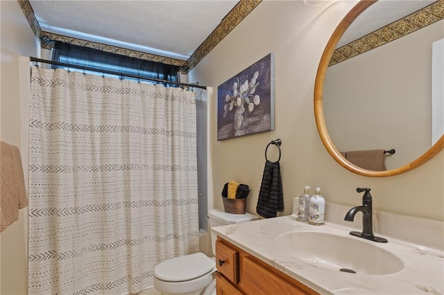 full bath with a textured ceiling, vanity, toilet, and curtained shower
