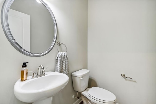 bathroom with sink and toilet