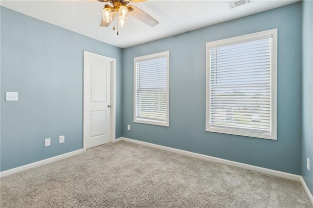 carpeted empty room with ceiling fan