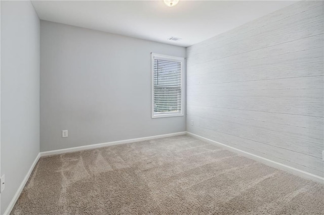 unfurnished room featuring carpet floors