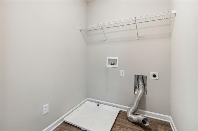 washroom with gas dryer hookup, hookup for a washing machine, hardwood / wood-style floors, and hookup for an electric dryer