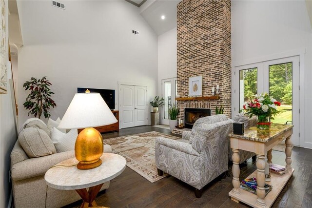 400 Fox Valley Dr, Monroe, GA 30656 - living area with high vaulted ceiling, dark wood-style flooring, a brick fireplace, and recessed lighting