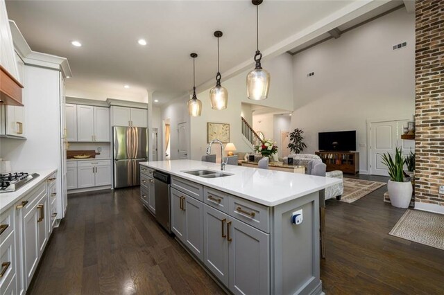 400 Fox Valley Dr, Monroe, GA 30656 - kitchen featuring a sink, stainless steel appliances, gray cabinets, light countertops, and beamed ceiling