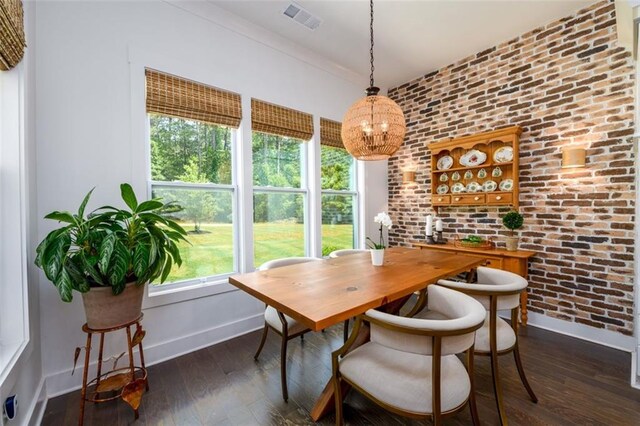 400 Fox Valley Dr, Monroe, GA 30656 - dining room with baseboards, a chandelier, dark wood-style flooring, and brick wall
