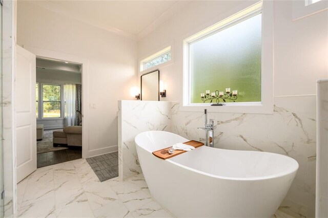 400 Fox Valley Dr, Monroe, GA 30656 - full bath featuring a soaking tub, marble finish flooring, and tile walls