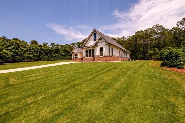 400 Fox Valley Dr, Monroe, GA 30656 - view of front of home featuring a front yard, brick siding, and driveway