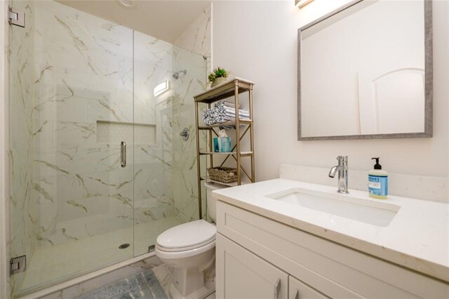 400 Fox Valley Dr, Monroe, GA 30656 - bathroom featuring toilet, a marble finish shower, vanity, and marble look tile flooring