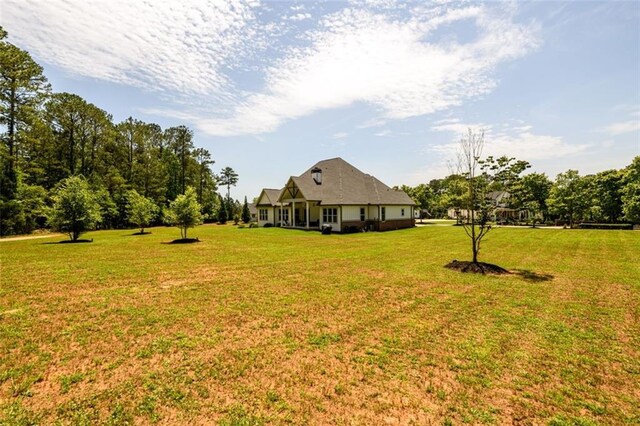 400 Fox Valley Dr, Monroe, GA 30656 - view of front of house with covered porch, brick siding, board and batten siding, and a front yard