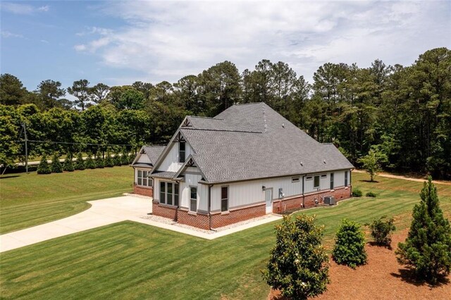 400 Fox Valley Dr, Monroe, GA 30656 - modern farmhouse style home featuring brick siding, driveway, a front yard, and an attached garage