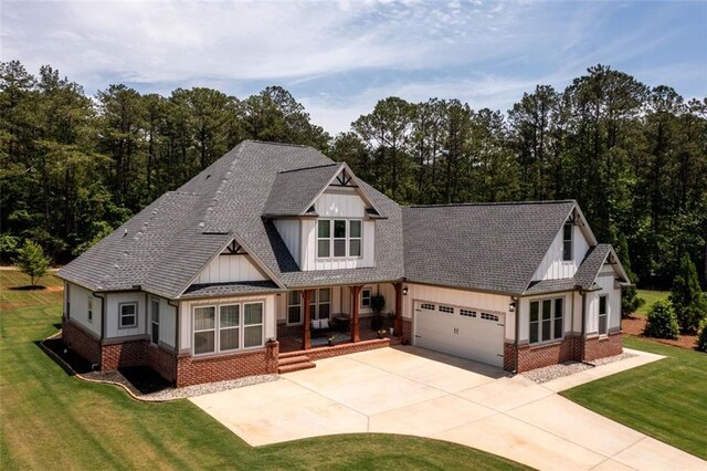 400 Fox Valley Dr, Monroe, GA 30656 - rear view of house featuring a yard, central air condition unit, brick siding, a patio area, and a shingled roof
