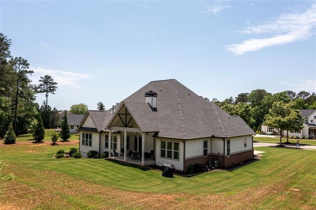 400 Fox Valley Dr, Monroe, GA 30656 - rear view of property featuring a yard, french doors, a patio, a chimney, and roof with shingles