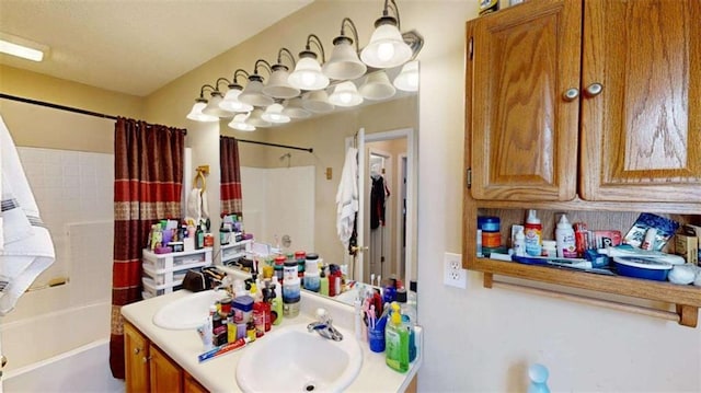 bathroom with shower / bath combo and vanity