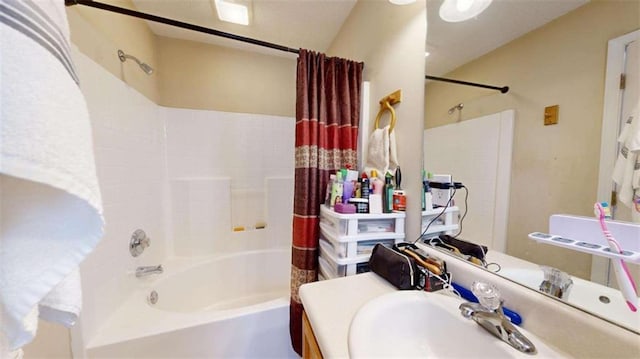 bathroom with shower / tub combo with curtain and sink