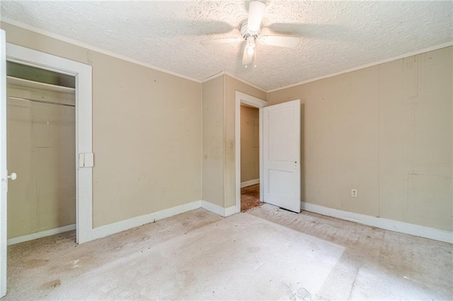 unfurnished bedroom featuring crown molding, a textured ceiling, ceiling fan, and baseboards