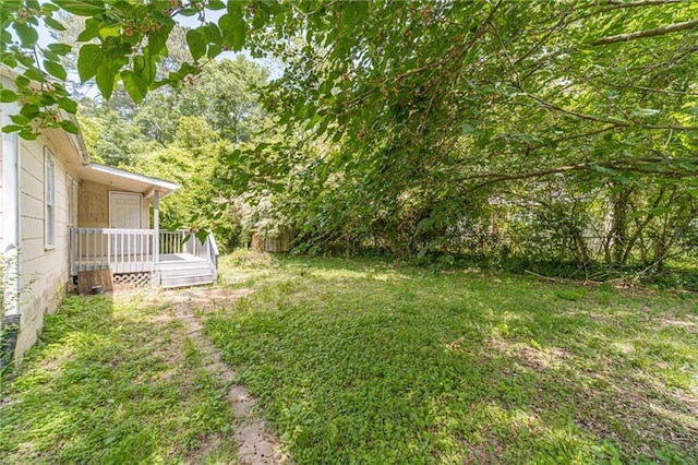 view of yard featuring a deck
