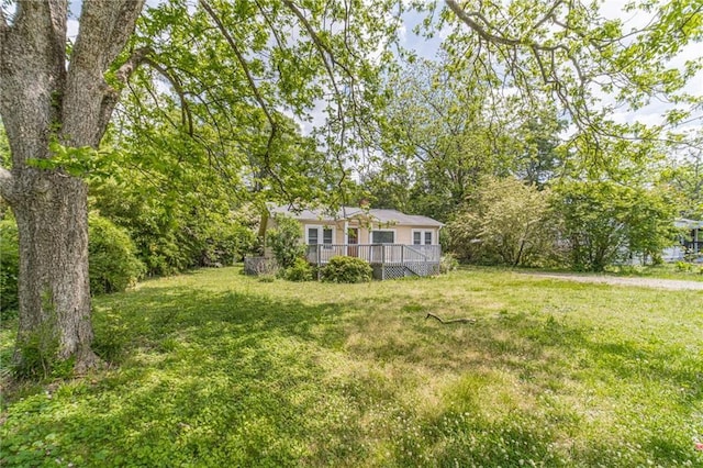 view of yard with a wooden deck