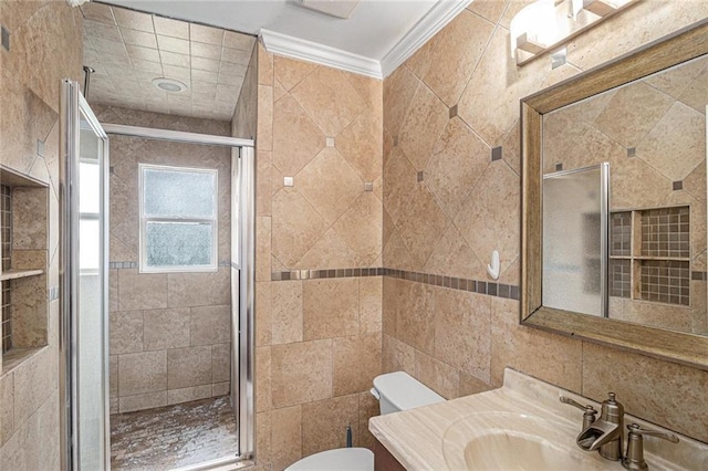 bathroom featuring tile walls, toilet, vanity, ornamental molding, and a shower stall