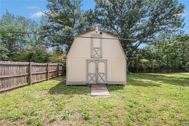 view of shed featuring fence