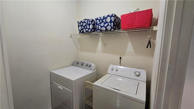 laundry area featuring laundry area and independent washer and dryer