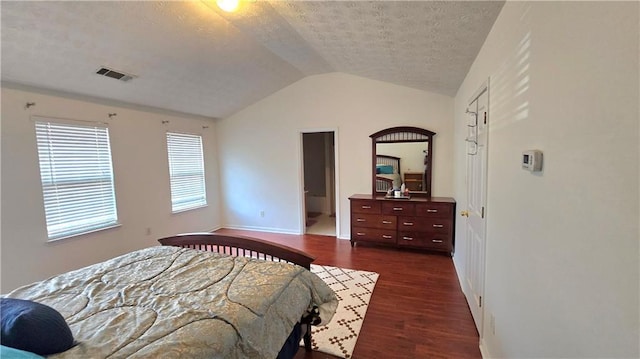 bedroom featuring visible vents, baseboards, vaulted ceiling, a textured ceiling, and dark wood-style flooring