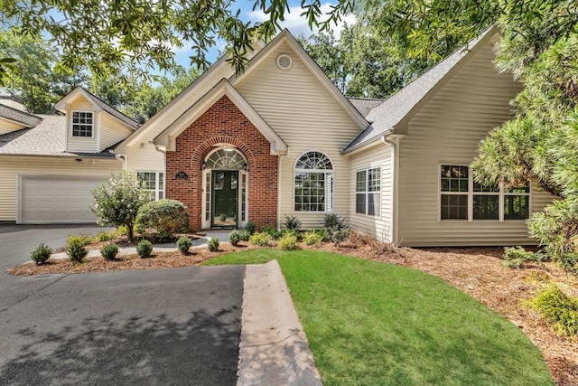 1249 Creek Forest Ln Bldg 8, Austell, GA 30106 - traditional home featuring an attached garage, a front lawn, driveway, brick siding, and a shingled roof