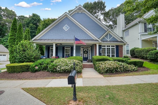 400 Pringle Dr, Suwanee, GA 30024 - view of front of house featuring a porch, a standing seam roof, a metal roof, and a front lawn