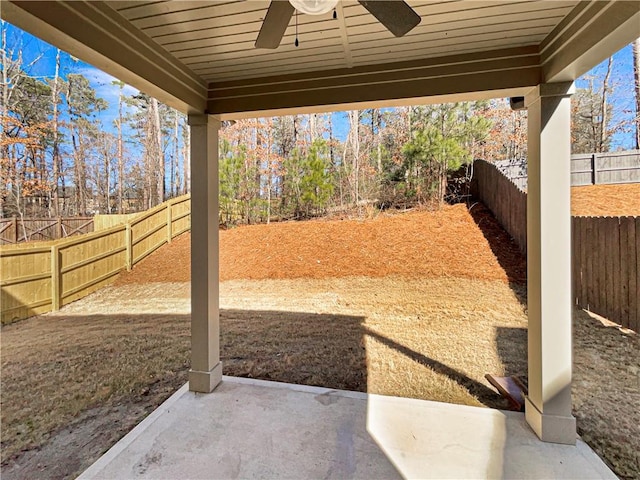 view of yard with a patio area, a fenced backyard, and ceiling fan