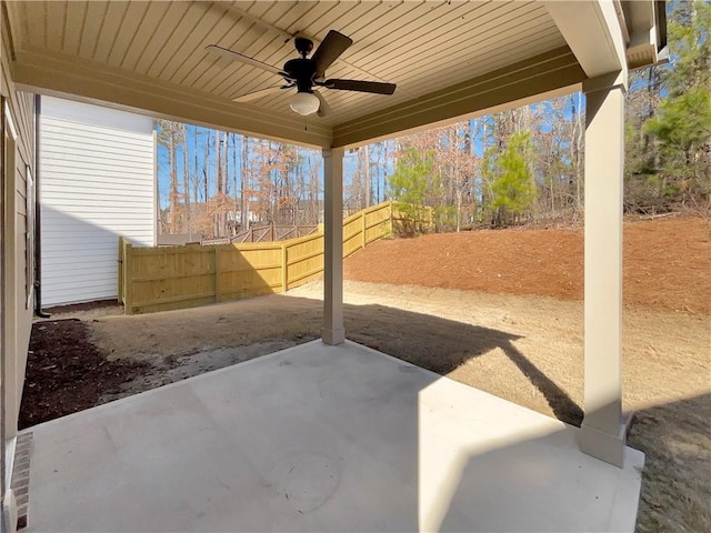 rear view of house with a patio, a ceiling fan, and fence