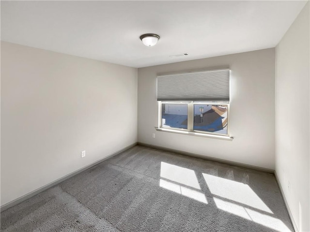 hallway with an upstairs landing, light colored carpet, and baseboards