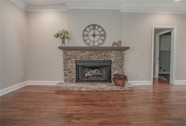 unfurnished living room with ornamental molding, dark hardwood / wood-style flooring, and a stone fireplace