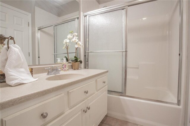 bathroom featuring shower / bath combination with glass door, vanity, and tile patterned floors