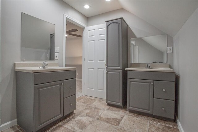 bathroom featuring lofted ceiling, vanity, and ceiling fan